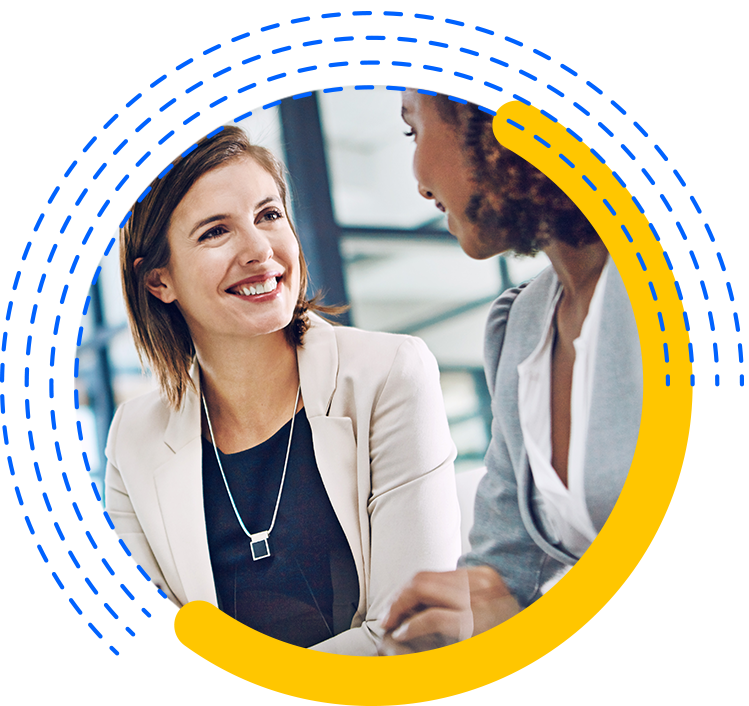 Two Confident Businesswomen at a Desk